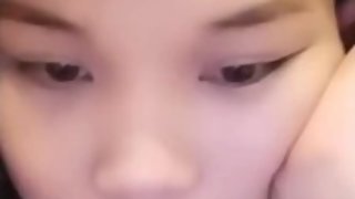 Busty asian teen showing tits