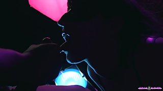 Goth girl gives a blowjob in a night club