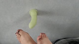 Sexy feet playing with a dildo
