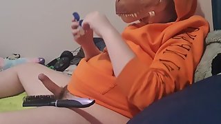 Jacking off wearing dino mask, with hairbrush in my butt