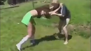 Mixed wrestling young couple outdoor